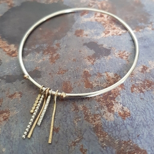 THE BLEND BANGLE: A BLEND OF TEXTURES AND PRECIOUS METALS THE BLEND BANGLE: A BLEND OF TEXTURES AND PRECIOUS METALS