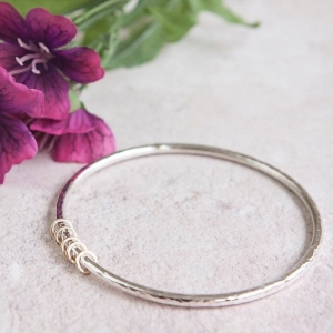 MILESTONE SILVER BANGLE WITH GOLD RINGS MILESTONE SILVER BANGLE WITH GOLD RINGS