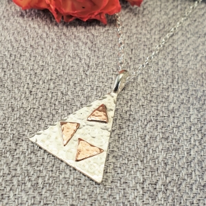 Tumbling Triangles Silver and Copper Pendant Necklace Tumbling Triangles Silver and Copper Pendant Necklace